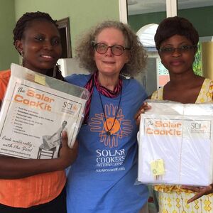 Paula Ann Winchester with two recipients of  from the Bremen Essiam village