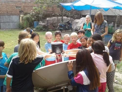 Enjoying with solar cooker.jpg (143 KB) Exploring the parabolic solar cooker - Photo credit: FoST