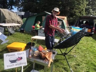 Dave Oxford of , hosted a solar cooking display at this year's Green Gathering 2023 in Wales, Photo credit: Dave Oxford