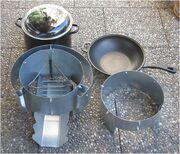 Ben 3 with tripod of round steel and stove shells for pot and pan