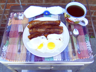 Bacon and eggs cooked on the Solar Fryer