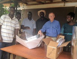 Roger Haines meets with the Alliance for African Assistance to discuss solar cooker distribution., photo - Roger Haines