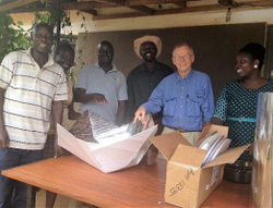 Roger Haines meets with the Alliance for African Assistance to discuss solar cooker distribution