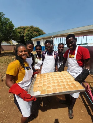 Happy trainees with buns fresh from the oven