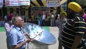 Sarvesh Chadda at solar cooking demonstration, 7-7-14