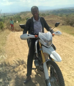 SCH 2, 2-15-24.png (744 KB) Aline Innocent arrives by motorcycle to help with the workshop