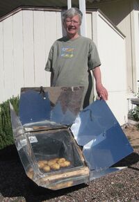 Jackie Harsha with her Global Sun Oven at her home in Mesa, Arizona