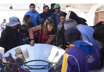 Virginia Bauso explains the workings of the parabolic solar cooker, 12-23-14