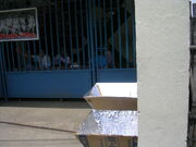 Two solar cookers at the Kong Hua School