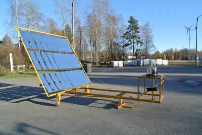 The Lytefire Solar Community cooker tested in Finland in 2015. And below, cooking in Kakuma, Kenya, in 2022.