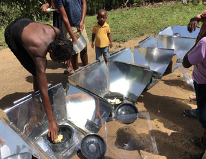 The Solar Oven Reflector ovens assist in preparing lunch