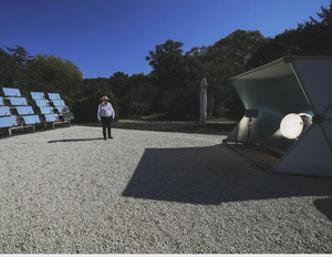 Antonio Durbe standing with the Pursole solar array coffee roaster in Rome, Photo credit: Andrew Medichini