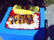 Shish Kabobs and Corn with a garnish of Fruit