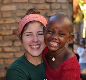 Katherine Russell with Nakawooya Victoria, 5, outside Nazareth Children’s Home in Nyendo, Uganda