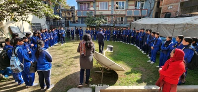 Students gather to hear Sanu Kaji Shrestha explain about solar energy