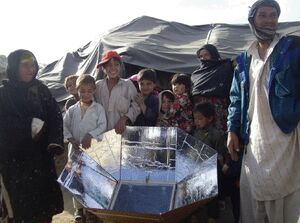 Trust in Education Afghan family with cooker, 4-7-13