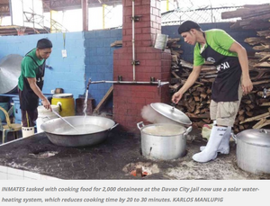 Inmates at the Davao City Jail use solar preheated water for cooking