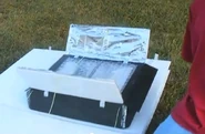 The next page opens a solar box cooker, which uses bubble wrap for the glazing cover.