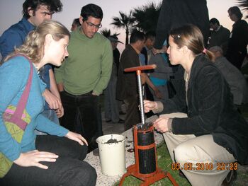 Briquette press being demonstrated at  conference in 2010