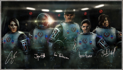 The ARK team, wearing diving suits.