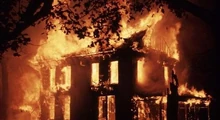 The farmhouse set ablaze.