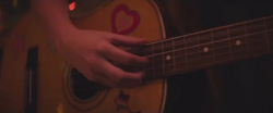 Maria Playing Guitar