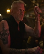 Barry Nerling as Tavern Tattooed Knuckle Cracker