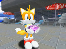 Tails showing his Chaos Emerald