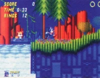 One of the first promotional images for Sonic 2, which was released during the summer of 1992. Features a shot of Hill Top Zone. In the final game, Tails cannot stand in the Gondola, which would also detach at the end of its line.