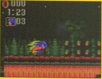 Sonic dashing through Meta Junglira Zone with a flaming Strike Dash. In the final game, the Strike Dash only makes sparkles.