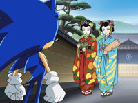 While Sonic is sightseeing he runs past a house. He then comes back to it only to have a brief conversation with two Japanese women wearing different colored kimonos. This is cut in the English dub.