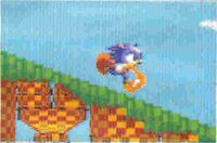 Sonic in Great Turquoise Zone with a different running sprite. It should be noted that the early Great Turquoise Zone had checkered-esque tiles which were altered in the final game.