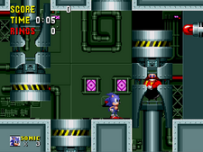 Screenshot of the game's final stage. Sonic is confined in a room with four hydraulic presses, two of which are active. Eggman is laughing inside one of the two.