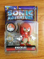 ReSaurus Knuckles figure with base, stand, ring, and sticker