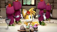 Tails in front of dessert tray