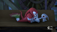 Knuckles plays with a bunny