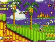 An early mockup of Emerald Hill Zone with an off-center Sonic. Note the Green Hill Zone clouds in the background and the Sonic the Hedgehog HUD.