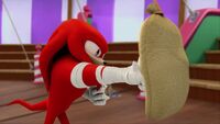 Boom Knux hits punching bag