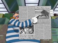 Eggman holding newspaper with Sonic on it