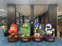 Statues of Rovio, Sammy, Sega and Atlus' mascots, Red, Aliyan, Sonic and Jack Frost, in the Sega Sammy reception area. (2024)