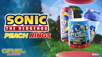Promotional graphic for the Peach Rings products, containing a can of the drink, a tub of the formula, and a Sonic shaker