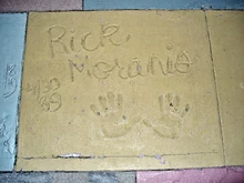 The handprints of Rick Moranis in front of The Great Movie Ride at Walt Disney World's theme park, Disney's Hollywood Studios
