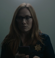 Rosie Marcel as Detective in Bathroom