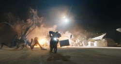  drives a motorcycle to lure 