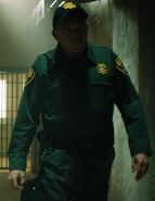 Wade Williams as Prison Guard