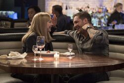 Anne Weying and Eddie Brock laughing promotional still