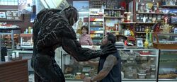 Venom stopping a robber promotional still