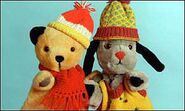 Sooty and Sweep wearing winter clothes