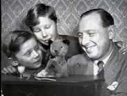 Dave Corbett (centre) with Sooty, his brother Matthew, and his father Harry