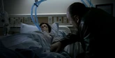 Tony holds Silvio's hand in the hospital